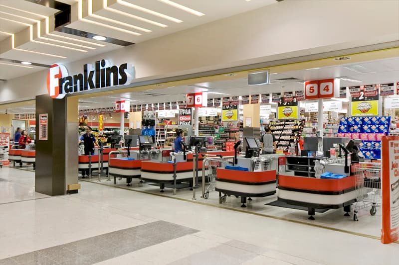 Supermarket aisle with stocked shelves